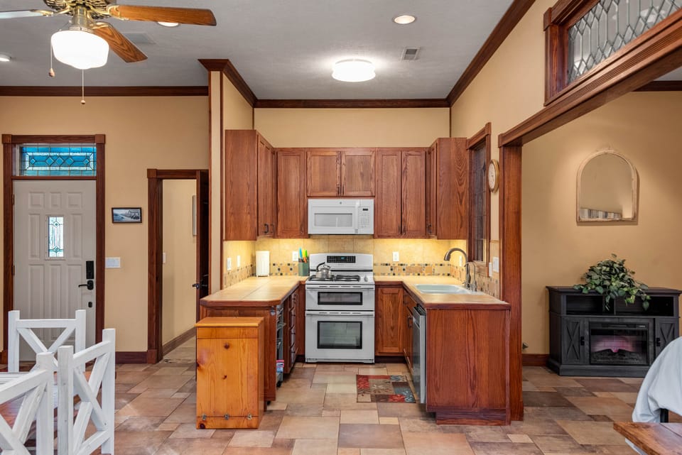 Efficient kitchen with gas oven/range and microwave. 