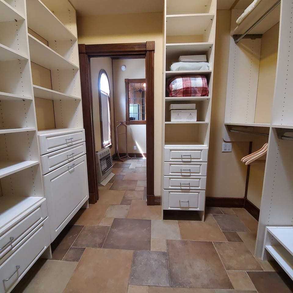 Walk-in closet provides lots of storage for your luggage and keepsakes.