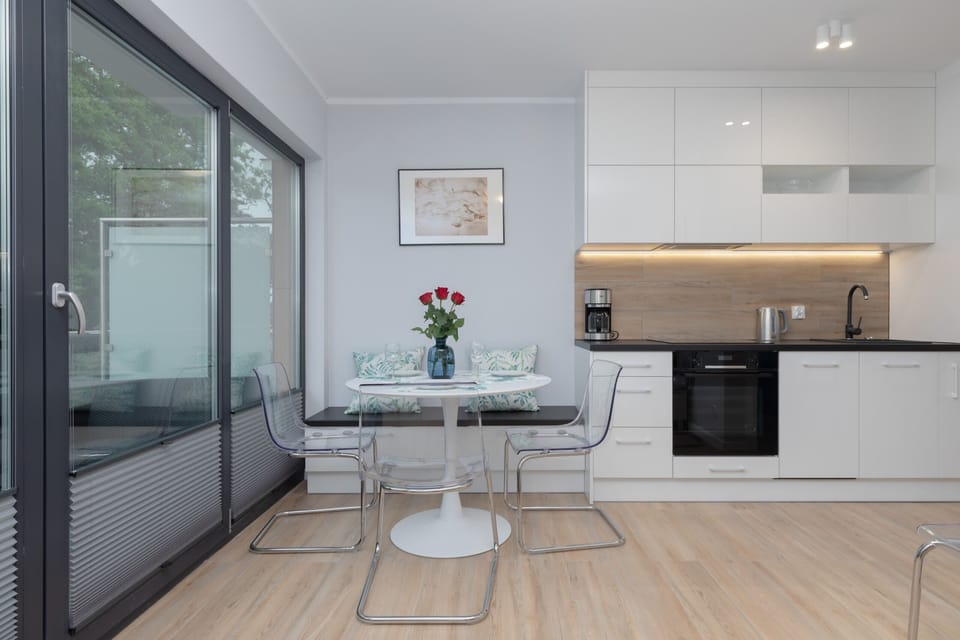 The living room features a sleek and modern aesthetic. 