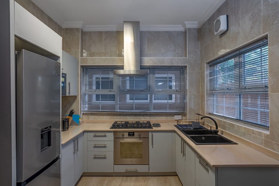 Luxury Townhome | Private kitchen | Coffee/tea maker, full-size fridge, microwave, oven