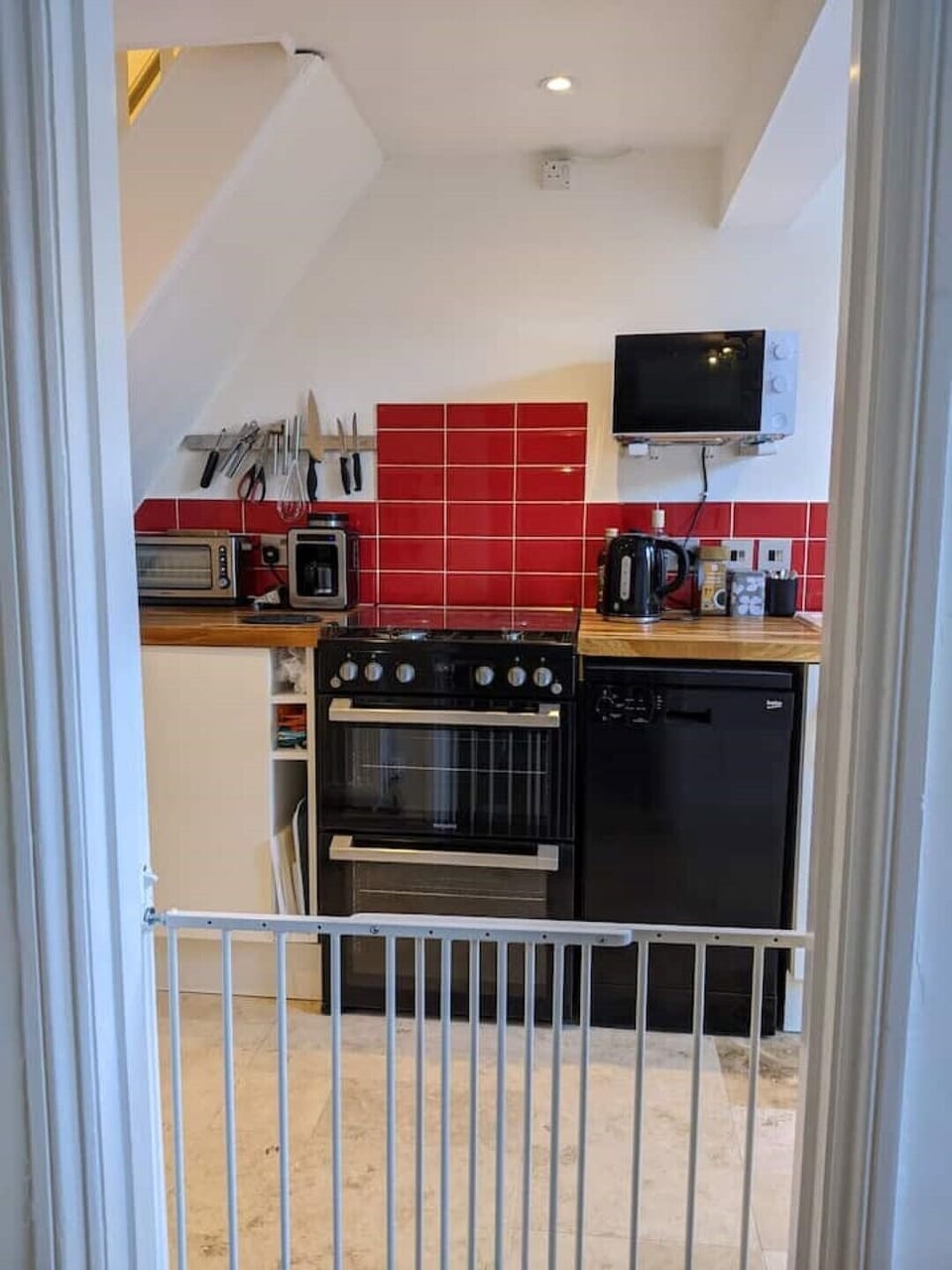 A gate from the dining room keeps little ones safe.