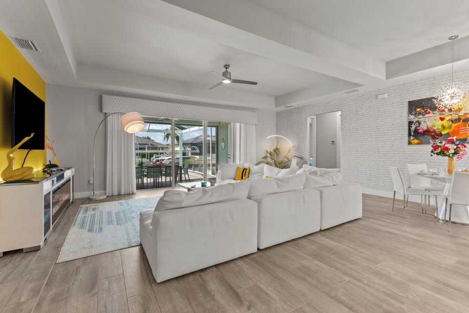 Living room with electric fireplace and large flat screen TV and connected PS4