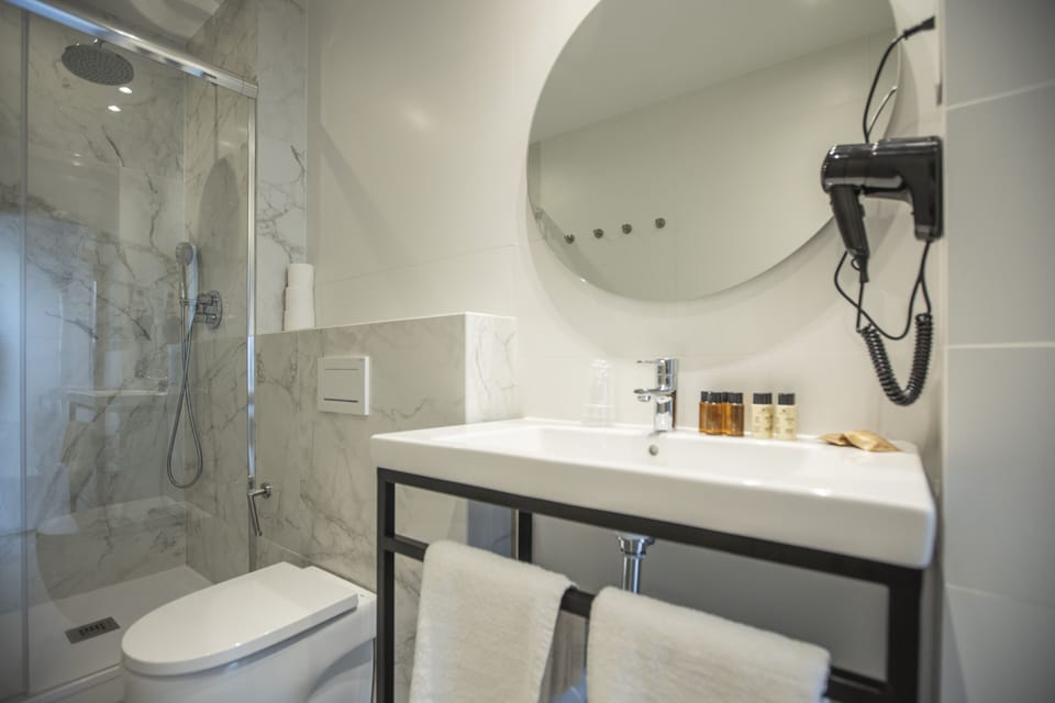Down comforters, memory foam beds, minibar, in-room safe