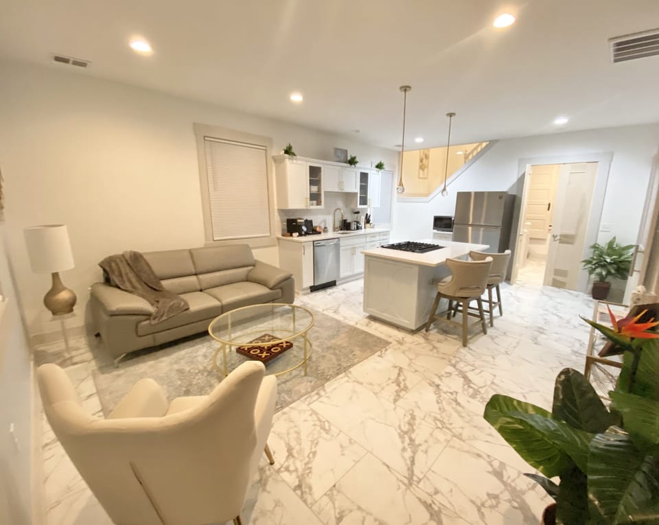 Living Room/Kitchen with soft and bright lighting. 