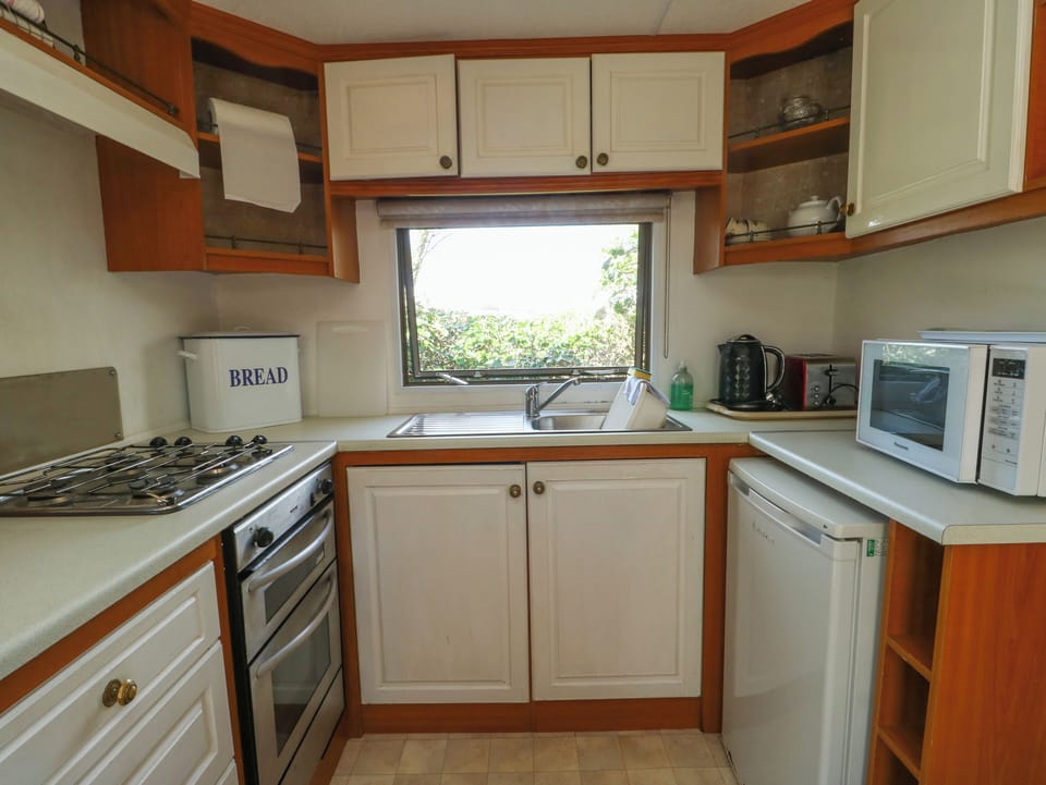 Fridge, electric kettle, toaster, cookware/dishes/utensils