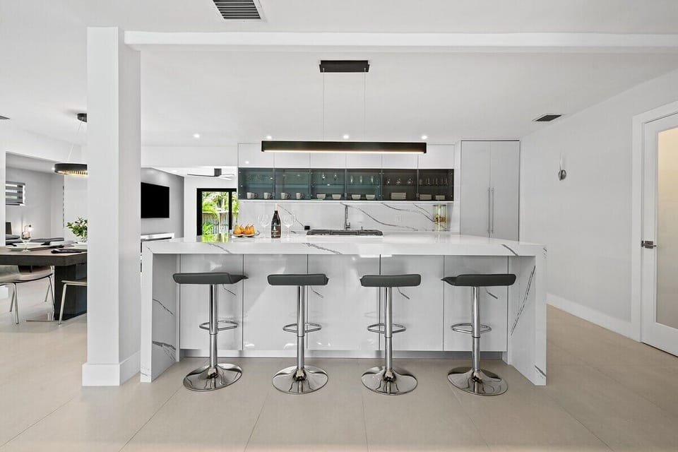 Prepare a family meal in the fully-equipped kitchen offering updated appliances and cookware, luxury quartz countertops and cabinetry and dine-in bar seating. The kitchen is situated in the open layout, which makes it perfect for gathering and entertaining.