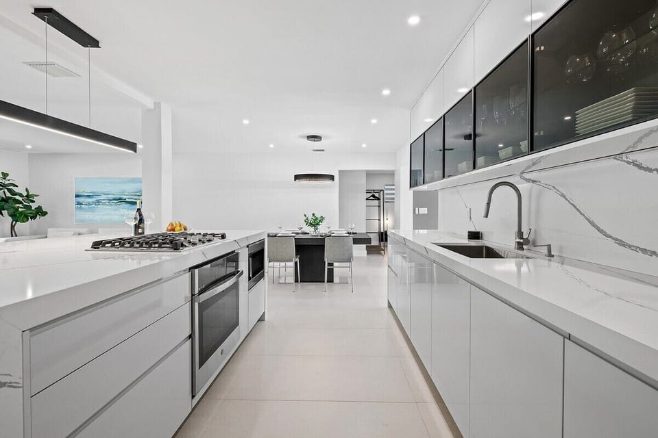 Prepare a family meal in the fully-equipped kitchen offering updated appliances and cookware, luxury quartz countertops and cabinetry and dine-in bar seating. The kitchen is situated in the open layout, which makes it perfect for gathering and entertaining.