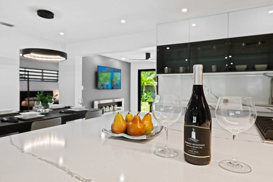 Prepare a family meal in the fully-equipped kitchen offering updated appliances and cookware, luxury quartz countertops and cabinetry and dine-in bar seating. The kitchen is situated in the open layout, which makes it perfect for gathering and entertaining.