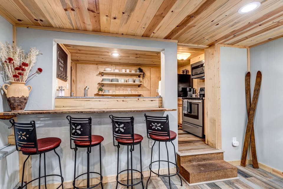 Entertainment Bar — Convenient bar seating connecting the recreation area and second kitchen.