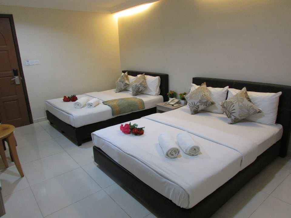Quadruple Room | Down comforters, minibar, in-room safe, desk