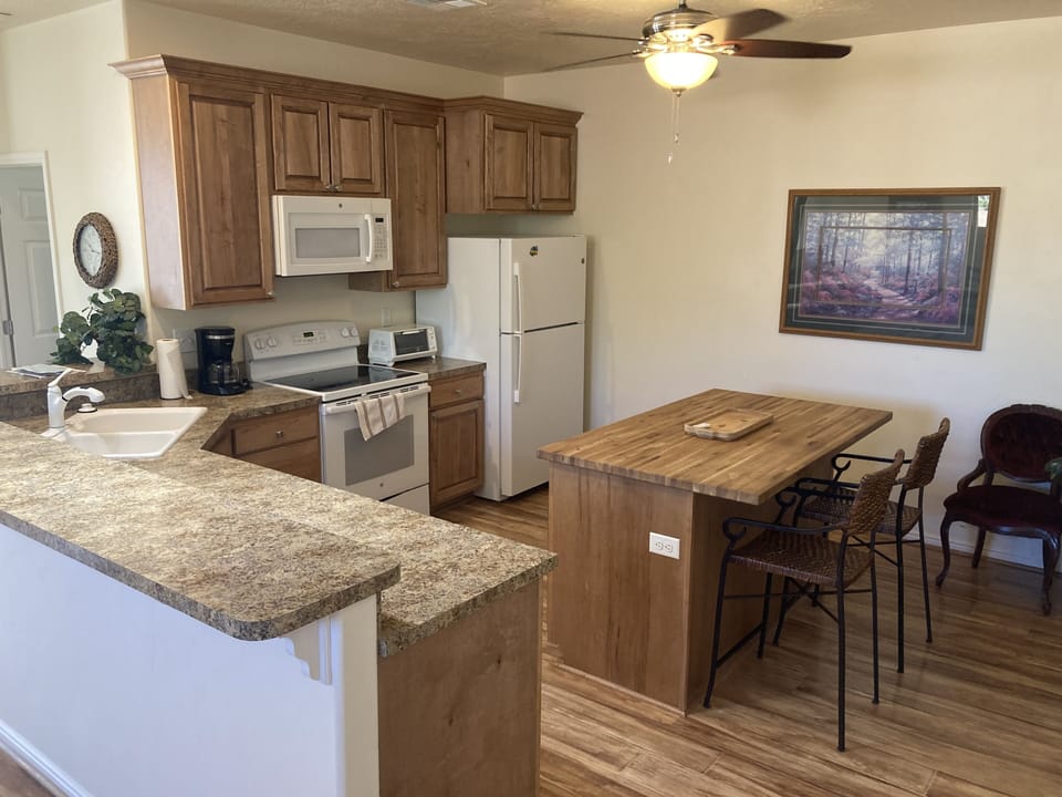 Fully equipped private kitchen with center island and service counter.