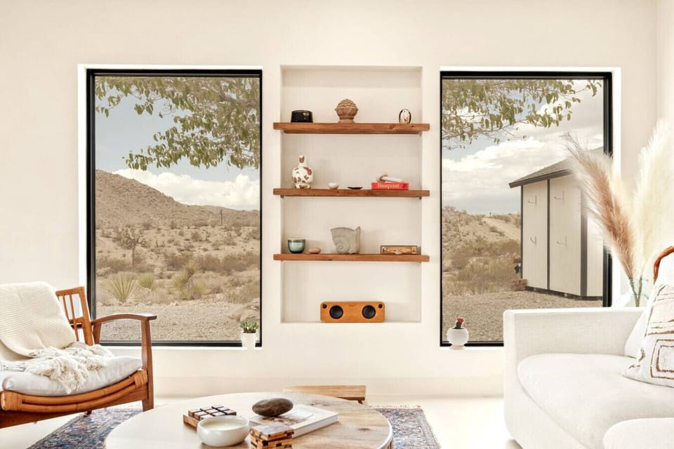 Living room Area full of natural light from the windows and sliding door.