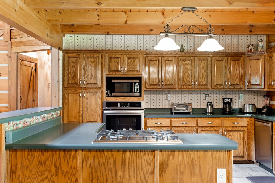 Plenty of kitchen utensils, microwave, conventional oven, small appliances. 