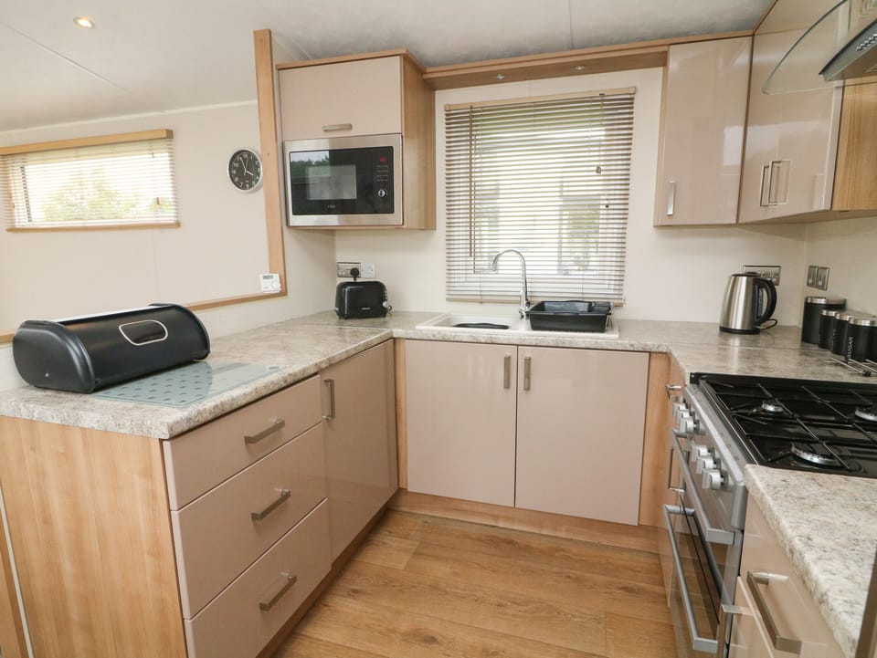 Fridge, electric kettle, cookware/dishes/utensils