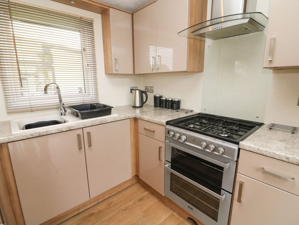 Fridge, electric kettle, cookware/dishes/utensils