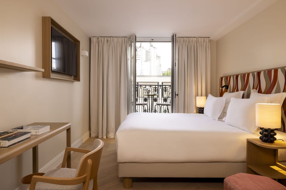 Deluxe Room, Balcony | Free minibar items, in-room safe, desk, laptop workspace