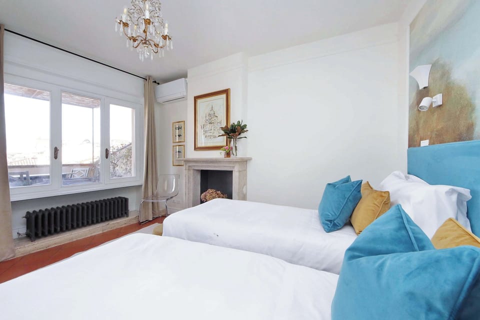 Sink into crisp white linens with vibrant blue accents as sunlight streams through your windows, creating a serene retreat.