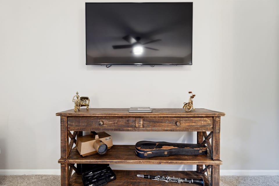 Master bedroom upstairs with king bed, Roku TV, and private balcony