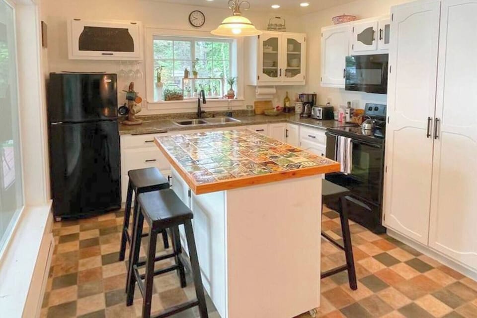 You'll love to cook in the fully-outfitted kitchen. Plenty of prep space as well as an island that can be used as an informal dining area for four.