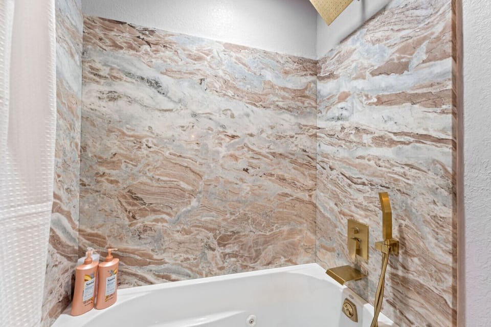 Slab marble everywhere! Bath amenities to enjoy the jacuzzi tub