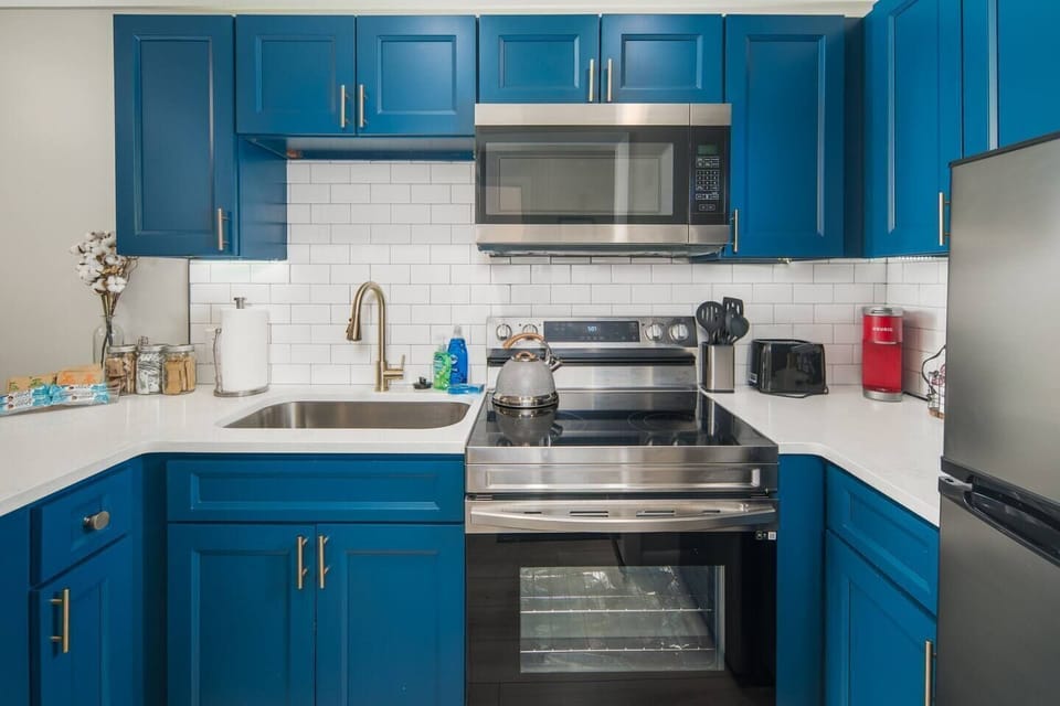 Updated well stocked kitchen with stainless steel appliances