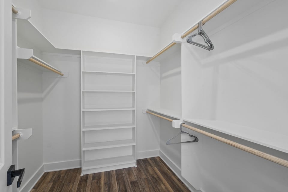 Large walk-in closet for primary bedroom.