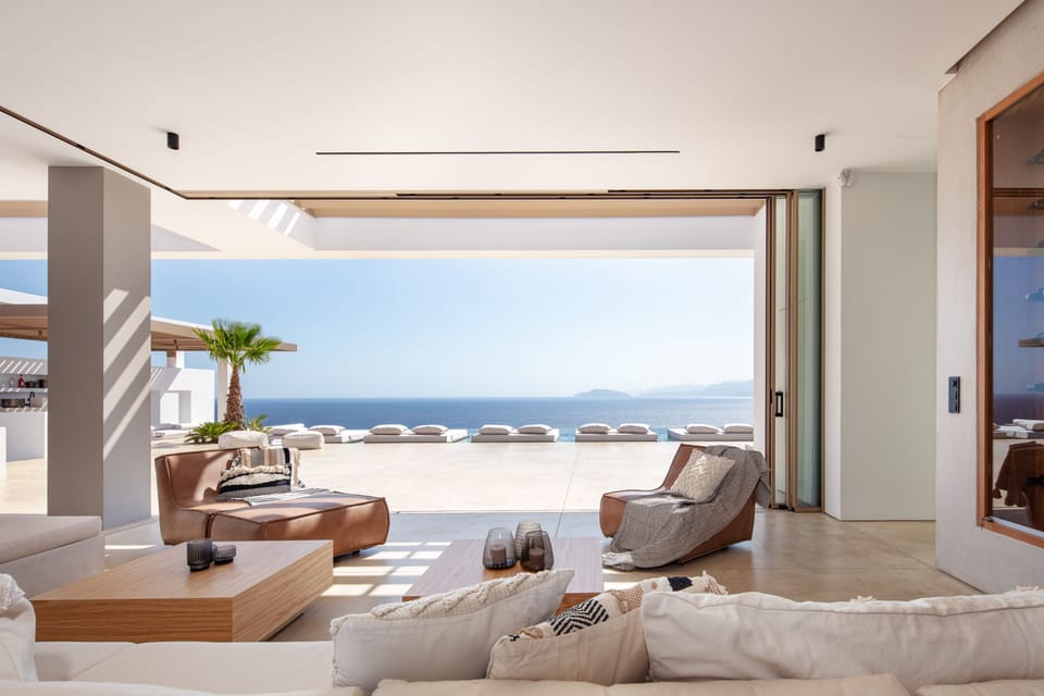 The spacious living room area connected to the pool terrace