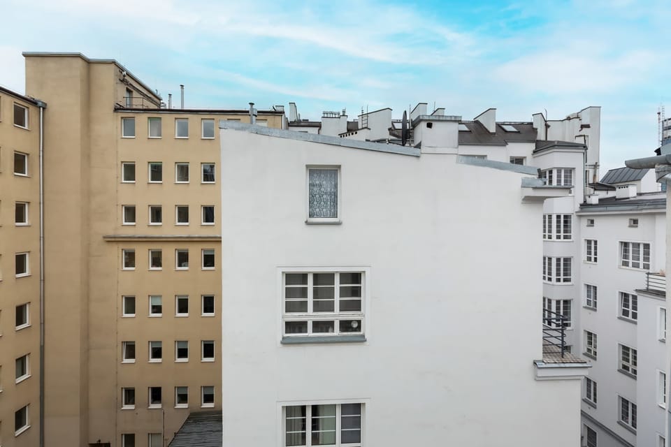 A view of the surrounding buildings, highlighting the neighborhood's architectural charm and urban setting.
