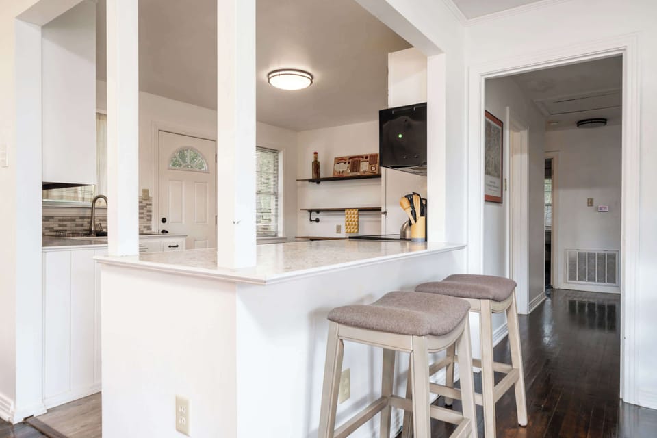 Entry into the kitchen from the hallway, or the dining area. 