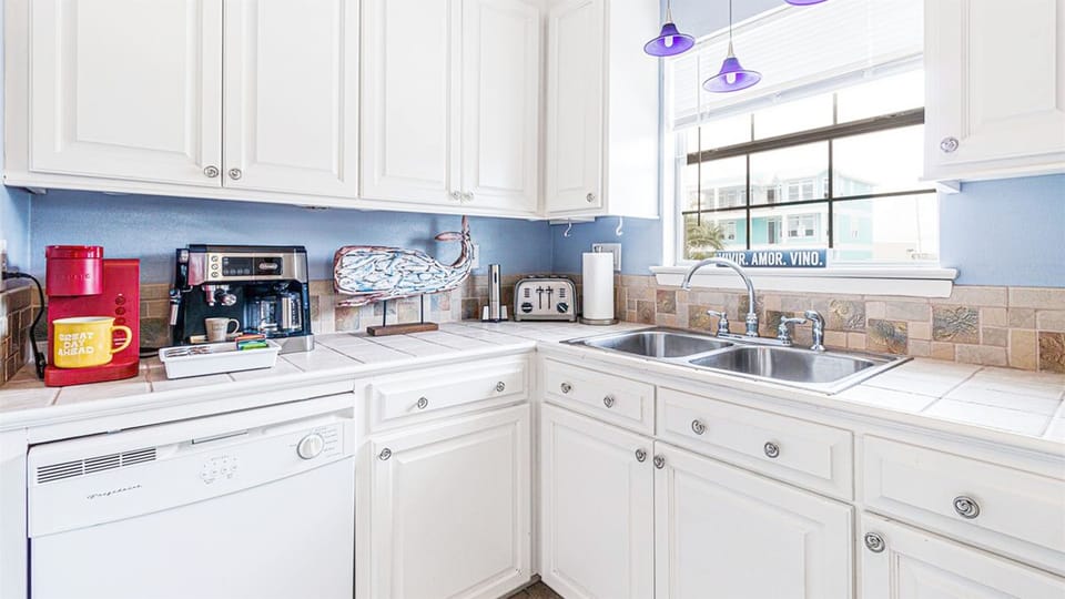 Oven, toaster, espresso / drip coffee maker, blender, crockpot, and microwave.