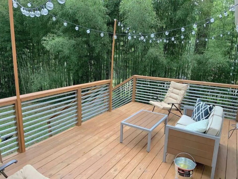 Relax on the private back deck with family and friends secluded by bamboo trees.