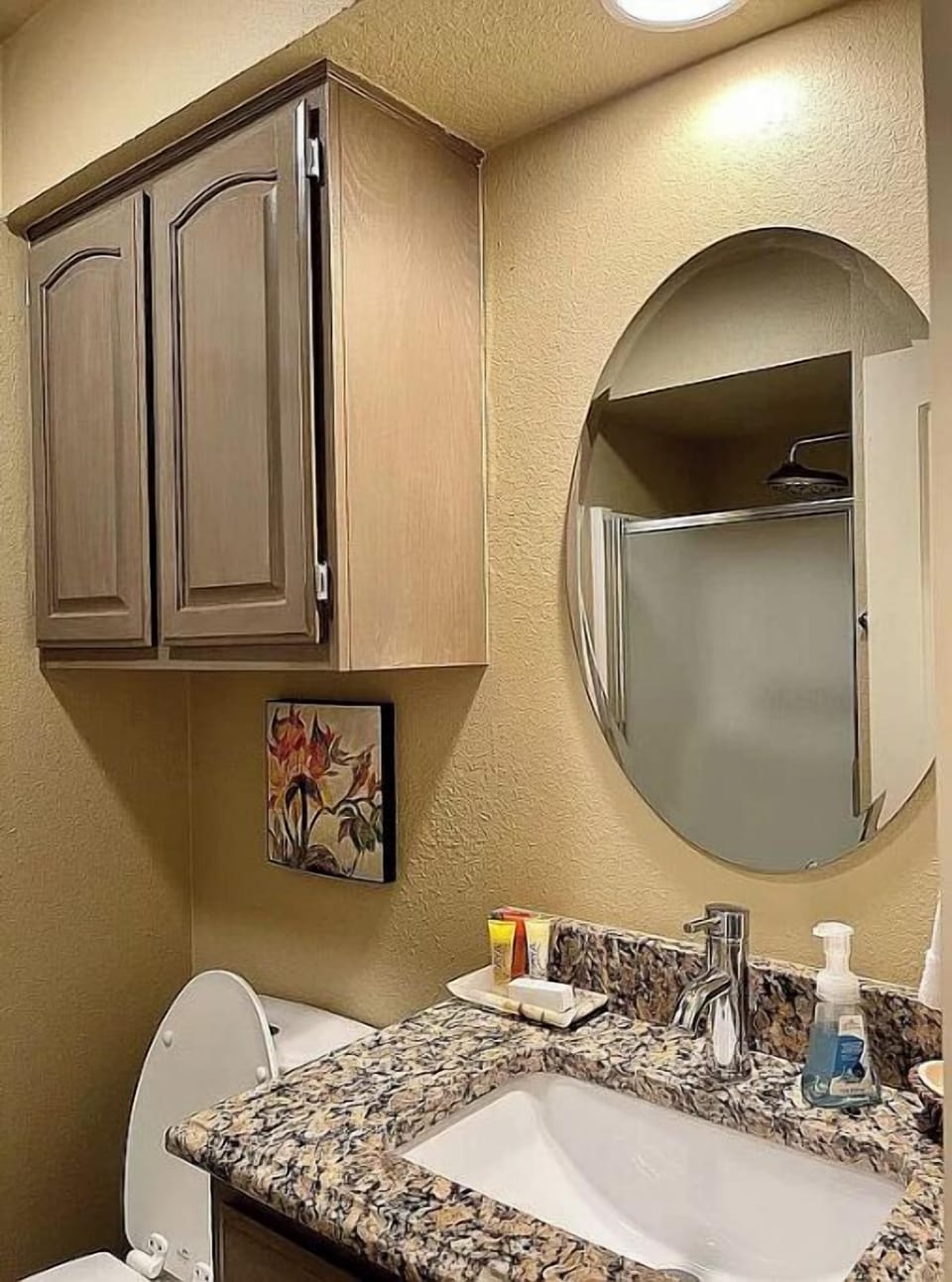 Third full bathroom with walk in shower in back hallway.
