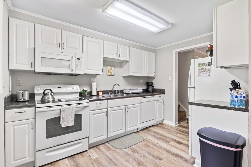 Full size kitchen, microwave, coffee pot, blender and other appliances. 
