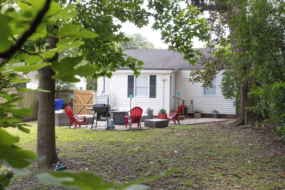 Backyard patio area with fire pit and gas grill. Plenty of seating for you and your family! (2)