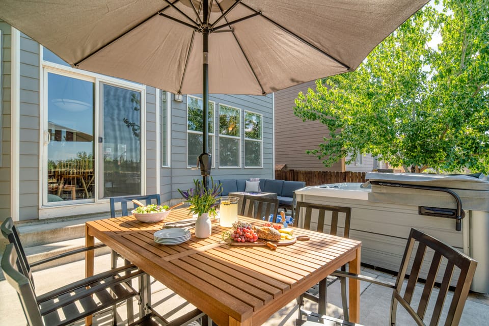The shaded outdoor dining area is perfect for an al fresco meal.