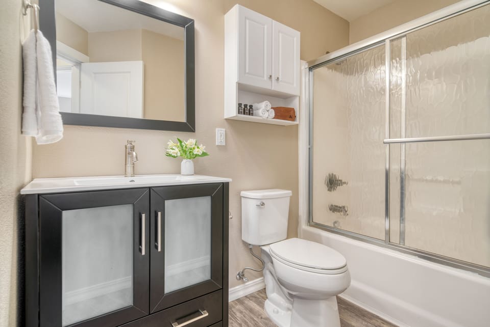 Bathroom 2 features a shower/tub combo.