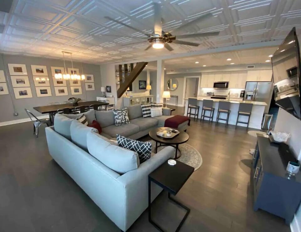 Open main living area.  Sectional sofa with smart TV.  Dining table seats 8.