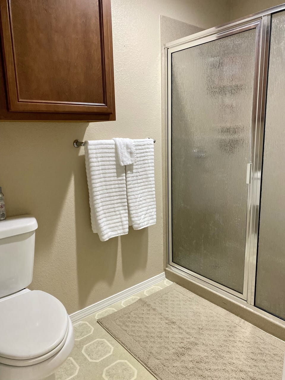 Separate toilet and shower in the master suite