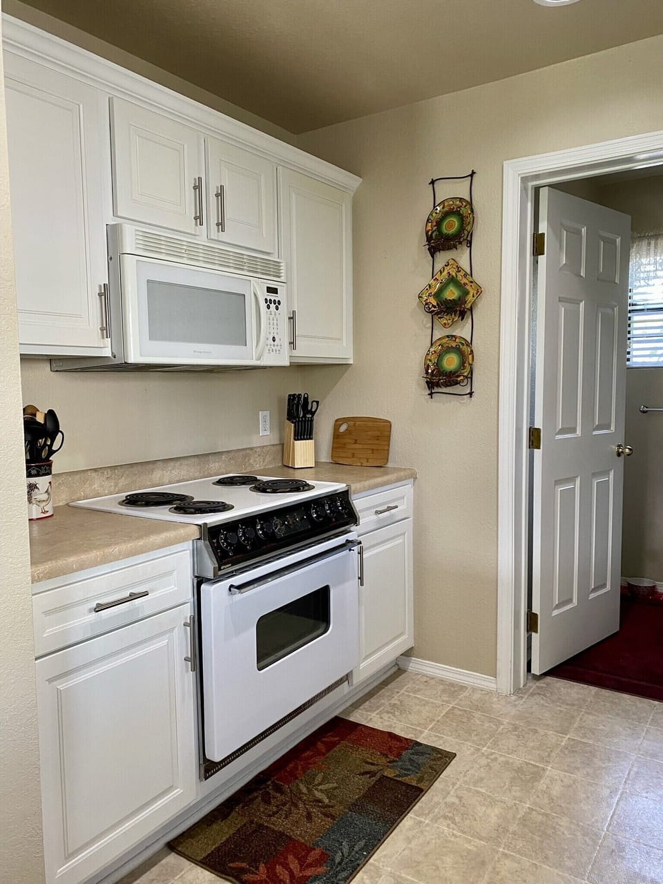 Oven/range, microwave and all of the equipment you need to prepare a meal 