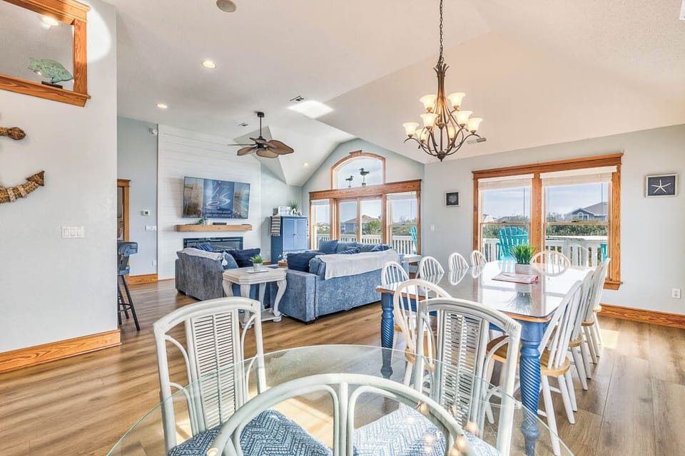 Top-Level Dining Room with Table (seats 10) and Additional Table (seats 4)