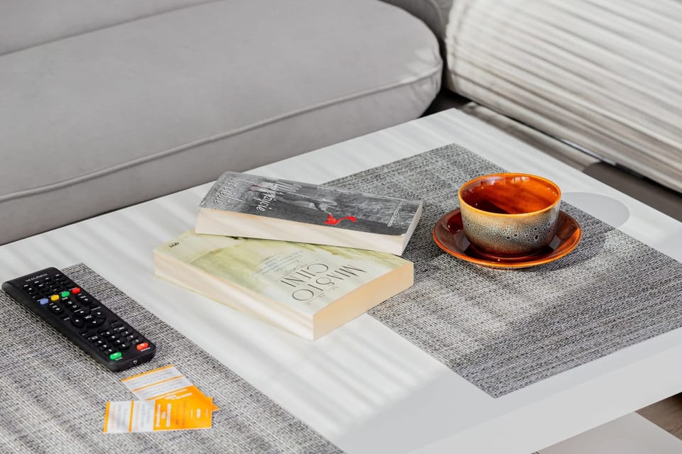 A cozy living space with a sectional sofa, neatly arranged decor, and a welcoming ambiance.
