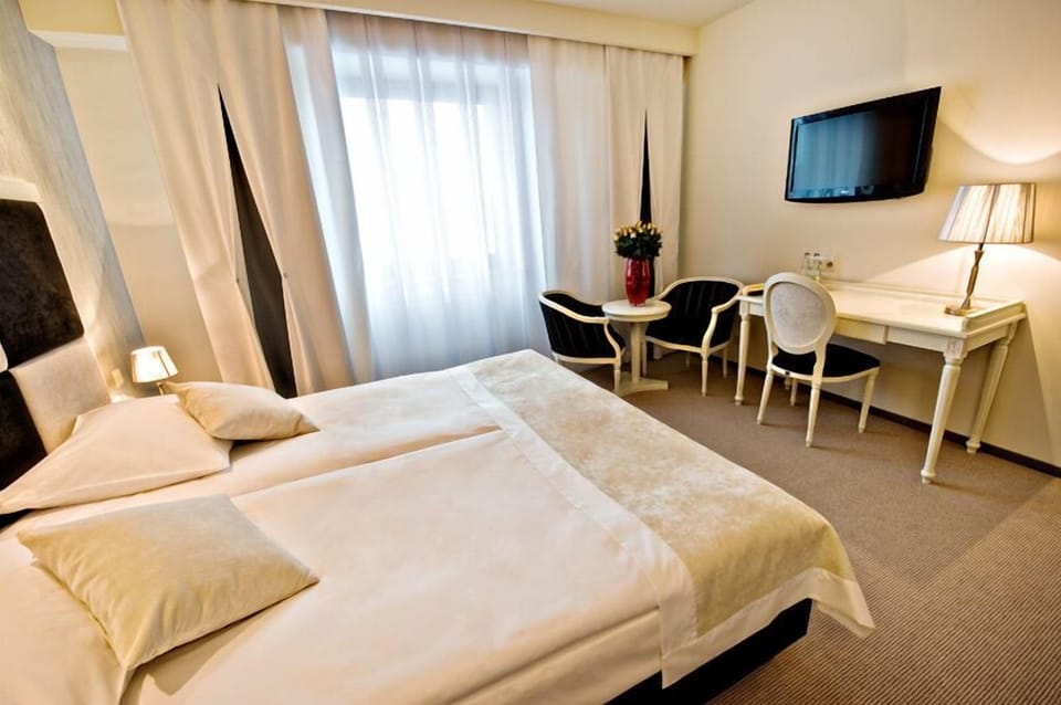 Premium bedding, blackout drapes, iron/ironing board (on request)