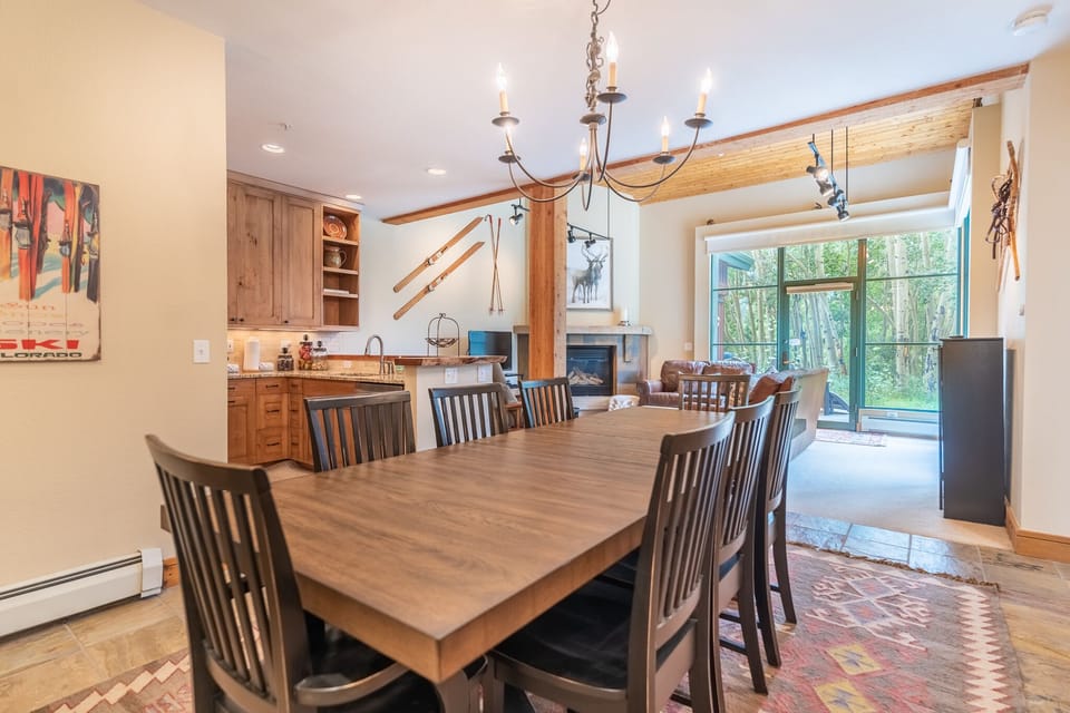 Gather around your warm wood dining table where conversations flow as naturally as the mountain views outside your window.
