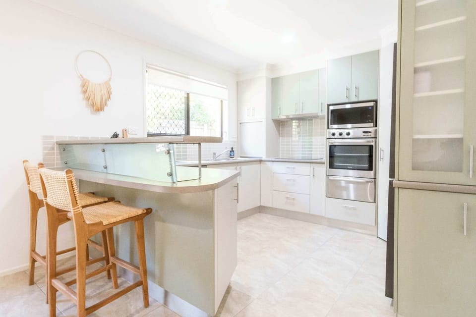 Spacious kitchen with modern appliances.