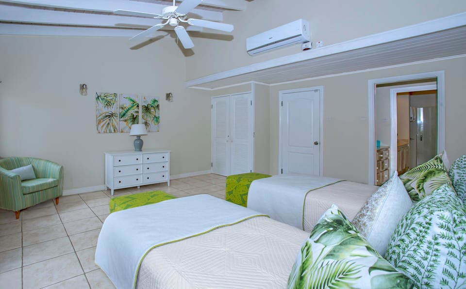 Bedroom # 2 with single beds (can be joined to create a bigger bed). With ceiling fan & A/C.