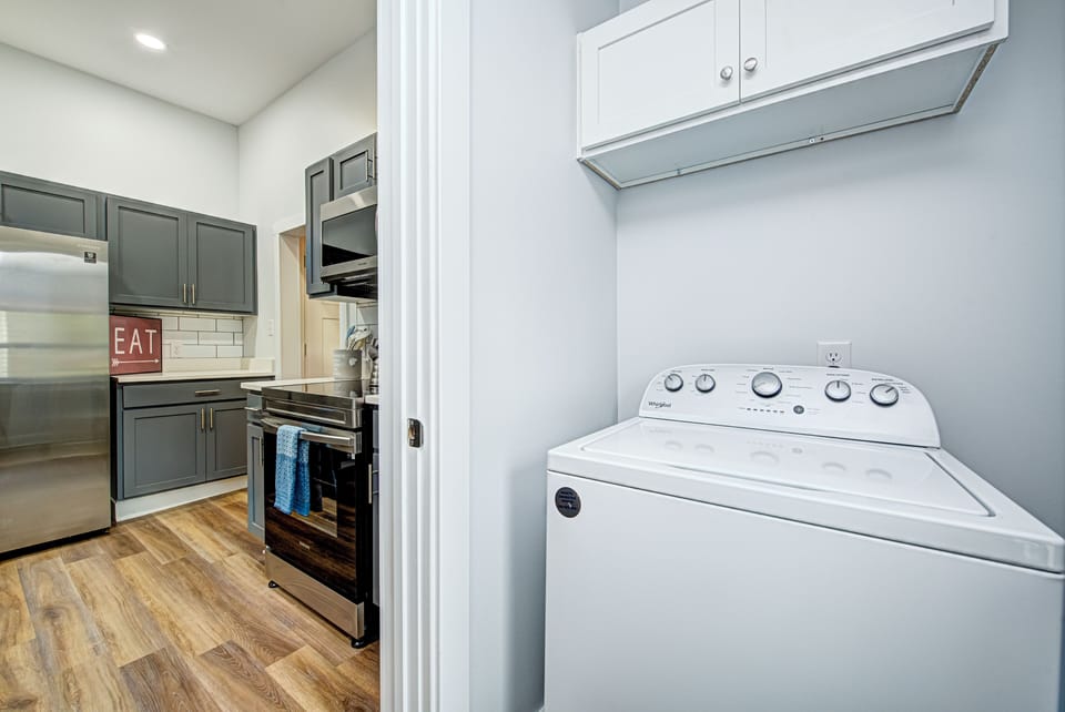Laundry Room With Full Sized Washer and Dryer. 