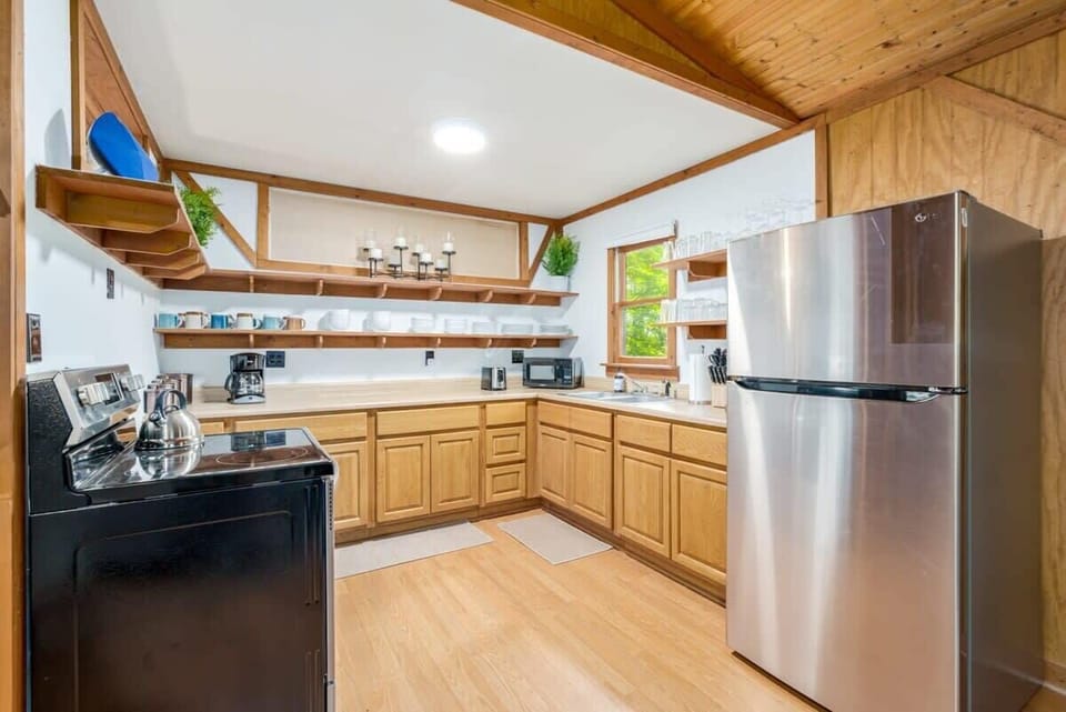 Fully stocked kitchen with fridge, stove, microwave