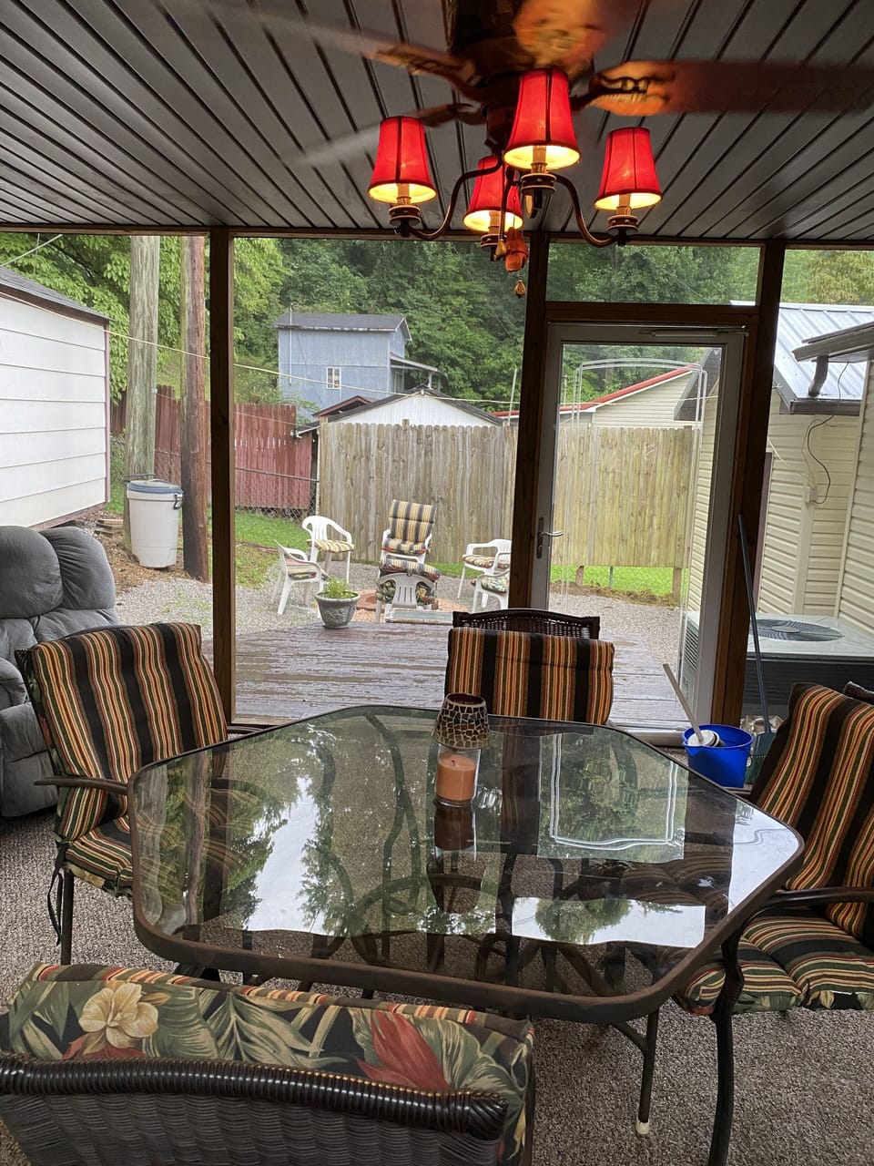 16x20 ft Screen-In Porch with recliners, two tables, compact Frig and work space