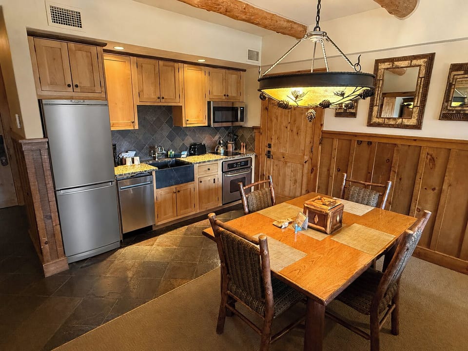 Fully equipped kitchen with custom alder wood cabinetry and granite counter top.