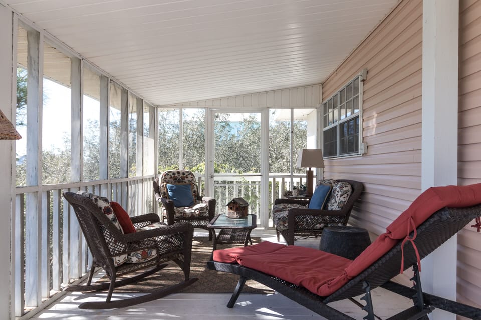 Relaxing screened porch also with dining area
